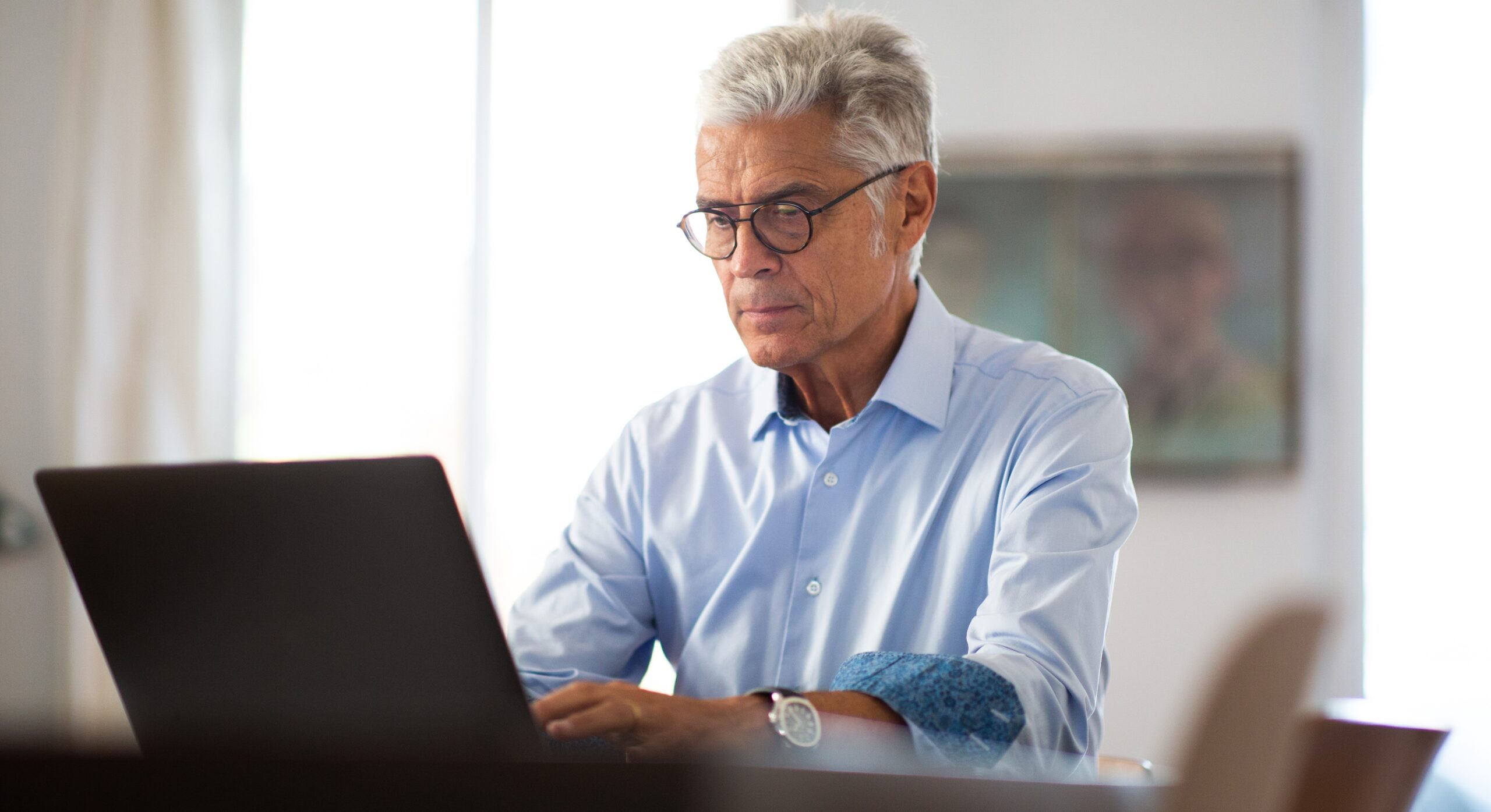 businessman working from home with laptop computer