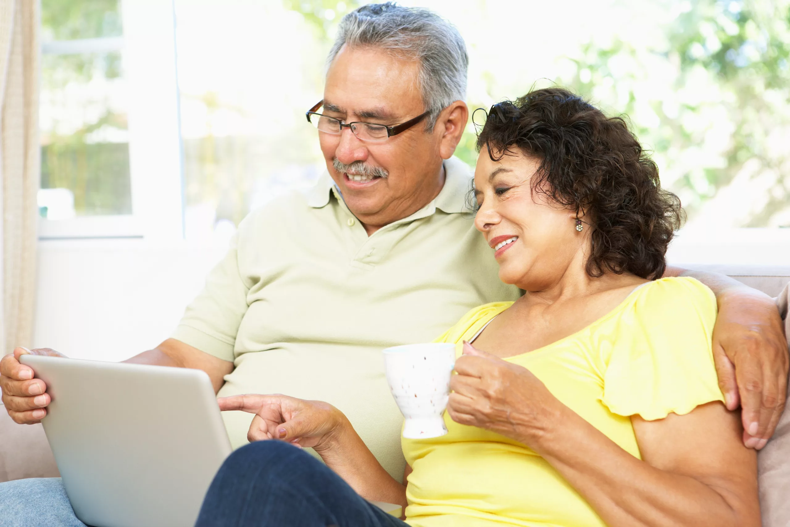 Hispanic Couple Reviewing Medicare Options